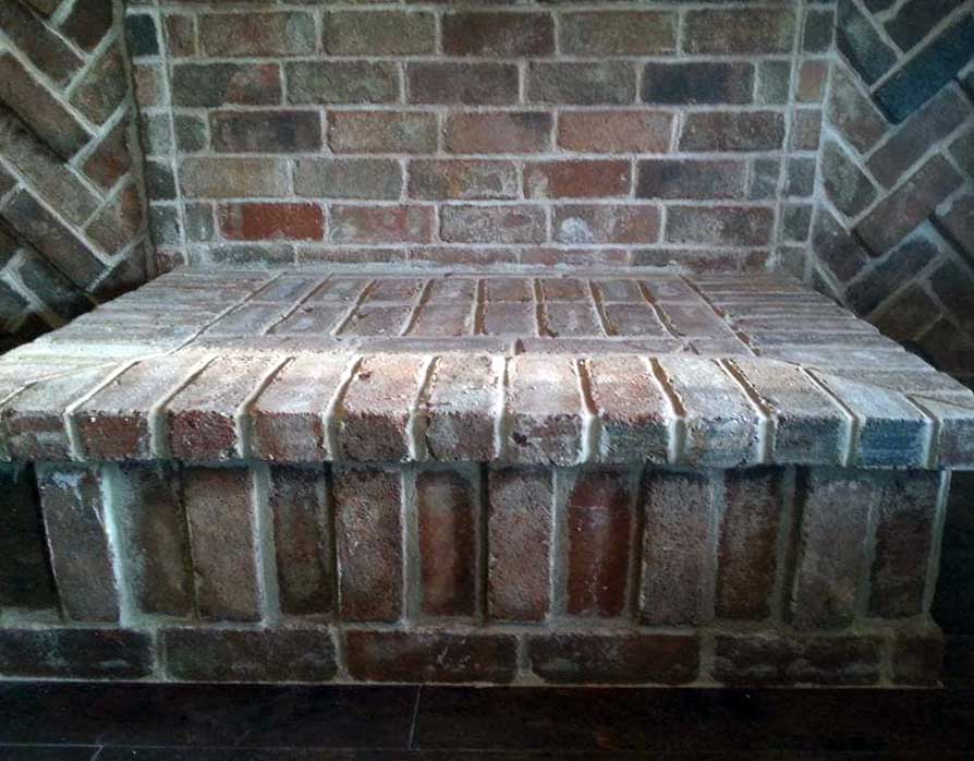 Detail of custom masonry chimney and fireplace created by American Masonry Arts in Northwest Arkansas